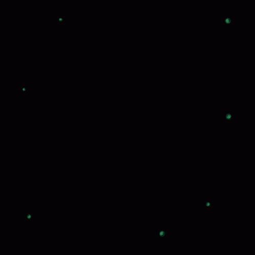 a clock and green dots on a black background