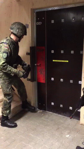 two soldiers working in an area where they can set up a door