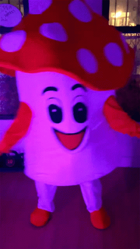 a big blue hat with purple spots is displayed in front of a television