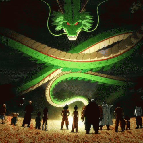 children stand in front of a lit up dragon statue
