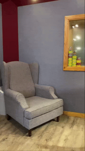 chair against wall with door to bathroom in background