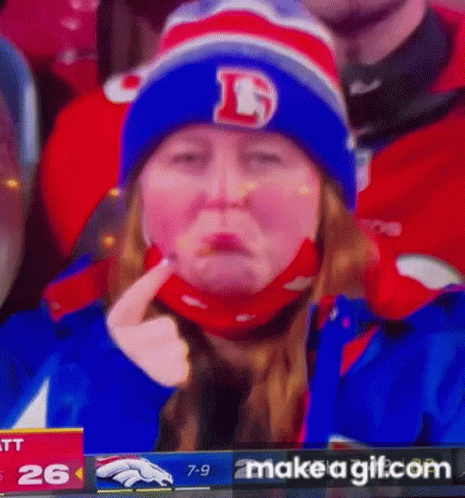 a baseball fan's face with a funny expression on tv
