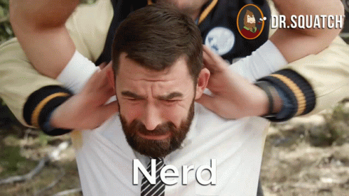 a guy with a beard, shirt and tie with the words nerd on it