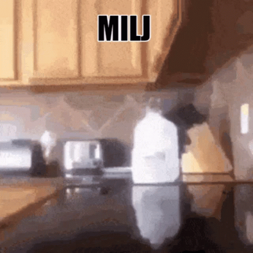 a blurred po of a person cleaning a sink