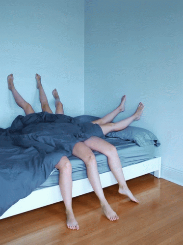 there are two legs above a bed
