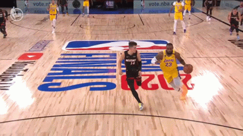 a man running across a basketball court