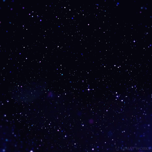 a blurry pograph of pink stars in the night sky