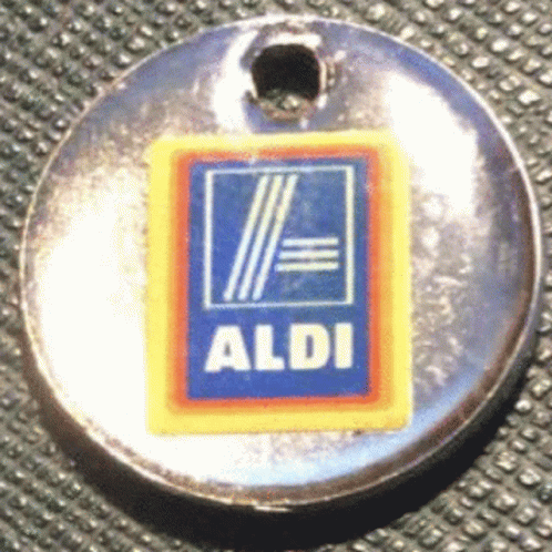 a metal identification badge on a metal surface