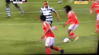 a blurry po of several soccer players on a field