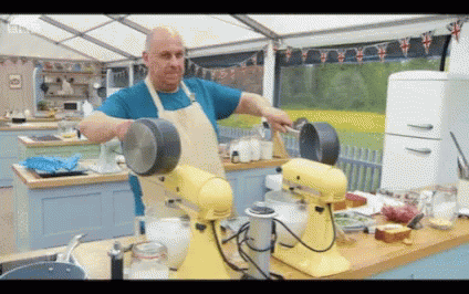 a man is mixing soing in a blue machine