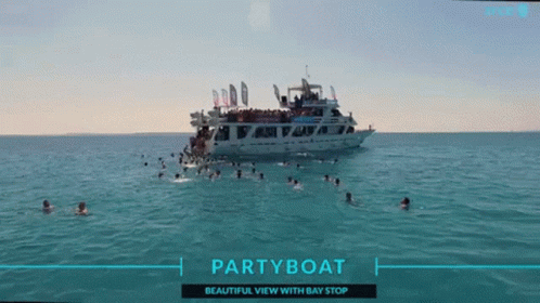 a large boat floats in the water at a party