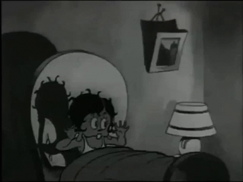 an old animated girl laying in bed with another girl