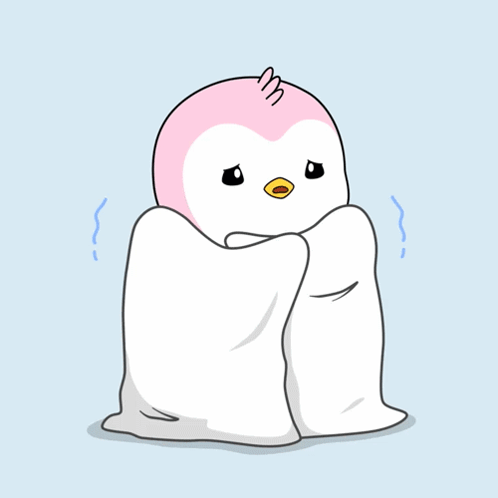 a small white and purple penguin wrapped in sheets