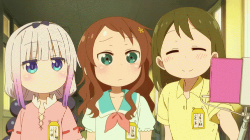 three anime girls wearing various outfits pose for the camera