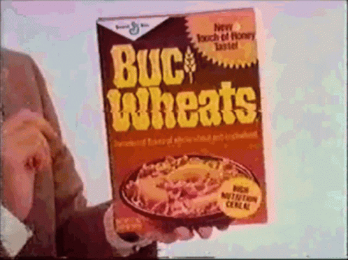 man holding a book that says budi'd wheats