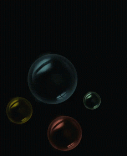 three round objects in the dark light