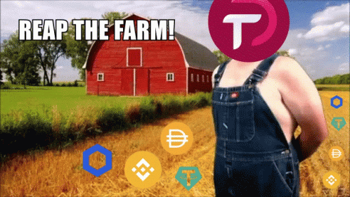 a person standing in front of a farm next to a blue barn