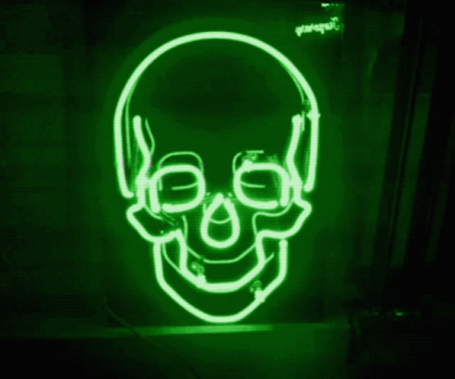 this neon sign has a skull with two ears