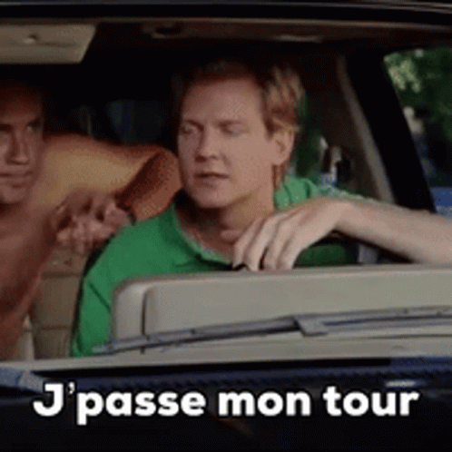 two men sit in the back seat of a car with text that says j'passe mon tour