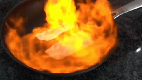 a blue fire flame in a frying pan