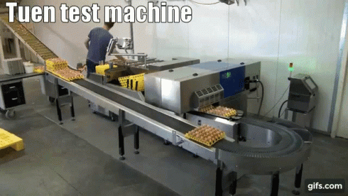 a line of machines in a warehouse with text over the top that says,'tuen test machine