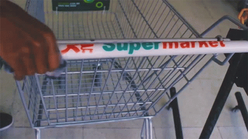 the sign is placed on the back of a shopping cart