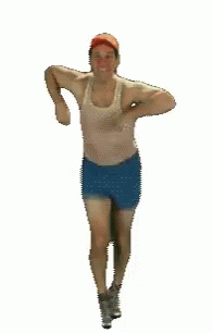 the image shows a man wearing shorts with his arms crossed