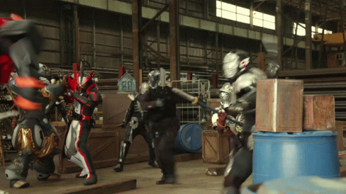 a group of robots and men walking in a warehouse