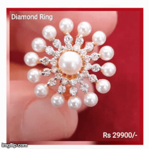 a brooch with pearls on it that says diamond ring