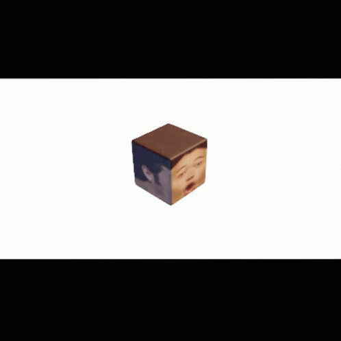 small blue cube with brown sides sitting on white surface