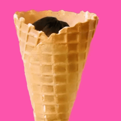 an ice cream cone with black chocolate and ice cream in it