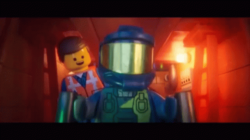 a lego person with a space suit is holding another figure