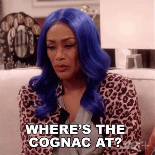 an image of a woman with red hair saying where's the cognac at?