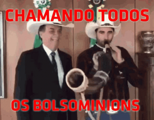 the two men are dressed in mexican hats and singing into a horn