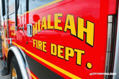 blue bus parked outside with stickers that say dialah fire department