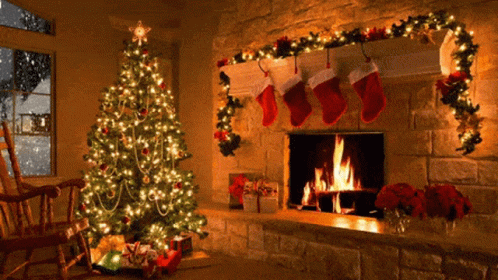 a decorated christmas tree is in front of a fireplace