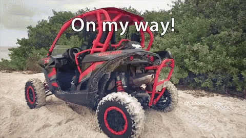a purple and brown atv driving down a hill with a caption