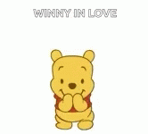a winnie the pooh character holding his arms