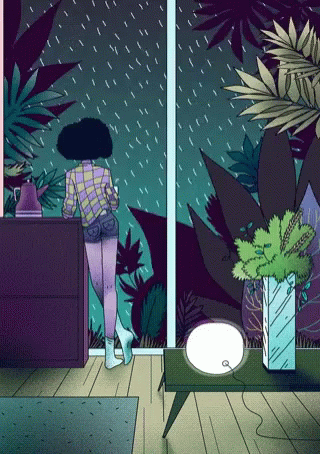 a person walking towards a doorway with plants in a room