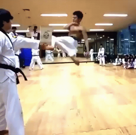 two people are in the middle of a martial competition