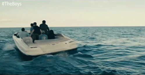 four people are in the water on a boat