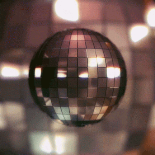 an abstract disco ball with lights in the background