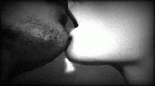 the kissing couple is seen in black and white