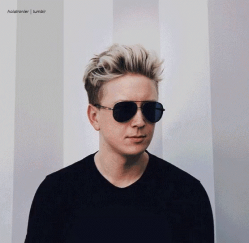 a man with a black shirt and some sunglasses