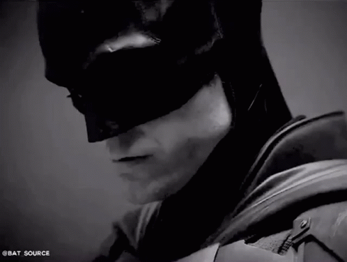 batman dark knight costume against a grey background