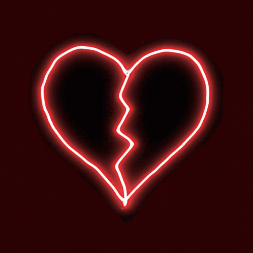 a broken heart in the dark with a blue neon background