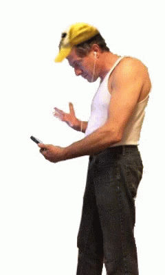 a man using a phone while standing up