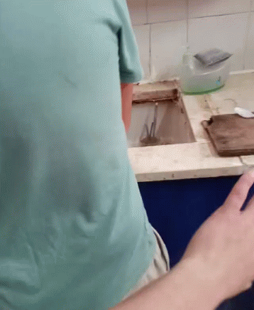 two hands pointing at soing on the counter top