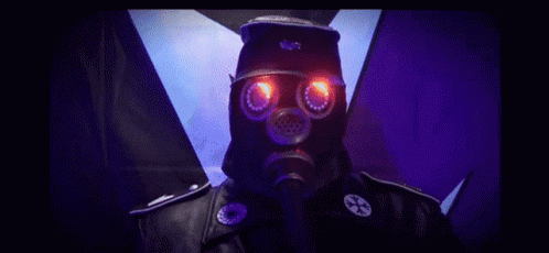 a man in gas mask with red and blue lights