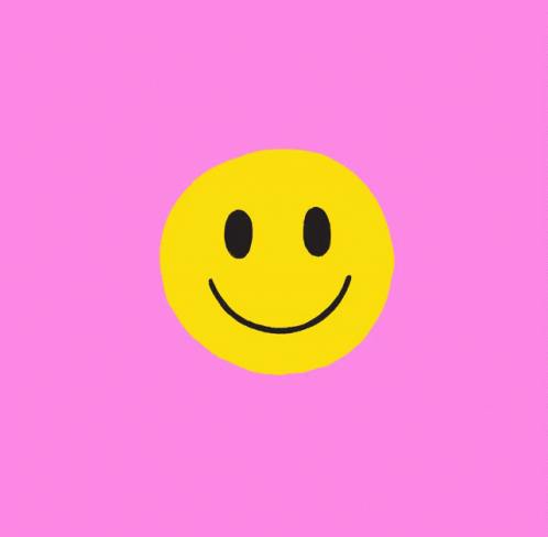 a small, blue circle has a black smiley face